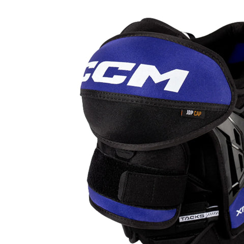 Black and blue hockey shoulder pad with CCM branding on a white background
