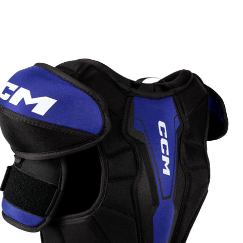 Black and blue CCM shoulder pad on a white background