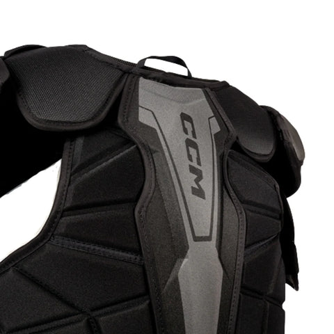 Black protective chest pad with CCM branding on a white background