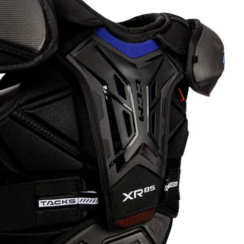Black protective chest pad with 'XRS' branding on a white background