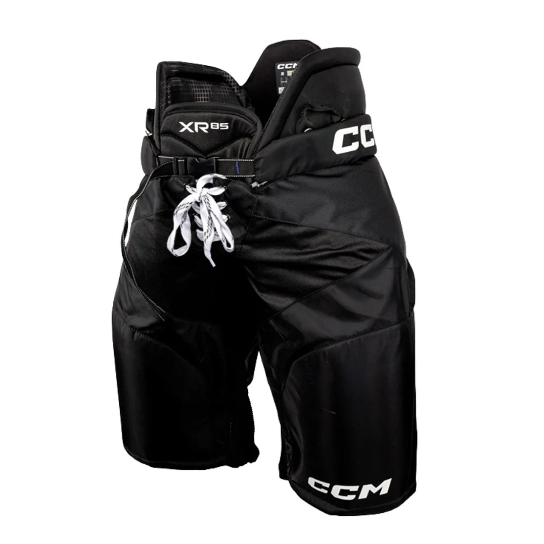 Black CCM XR85 ice hockey pants with white laces and white CCM branding, shown against a plain white background.