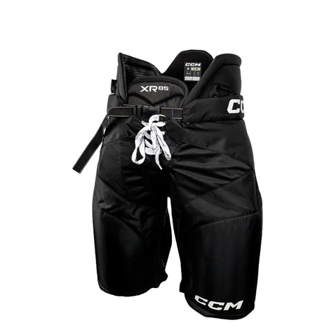 Black hockey pants with CCM branding on a white background