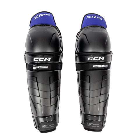 Pair of CCM hockey shin guards on a white background