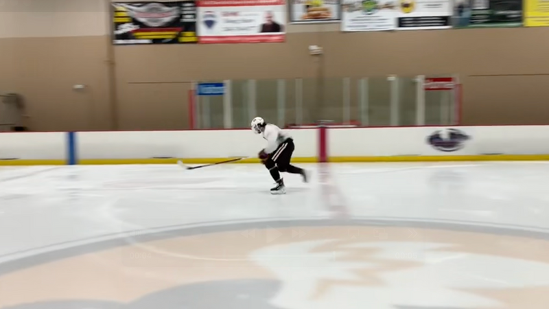Hockey Skater gliding along a rink